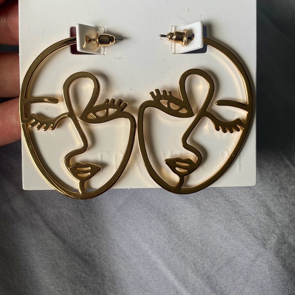 Abstract face drop earrings with minimal art winking face